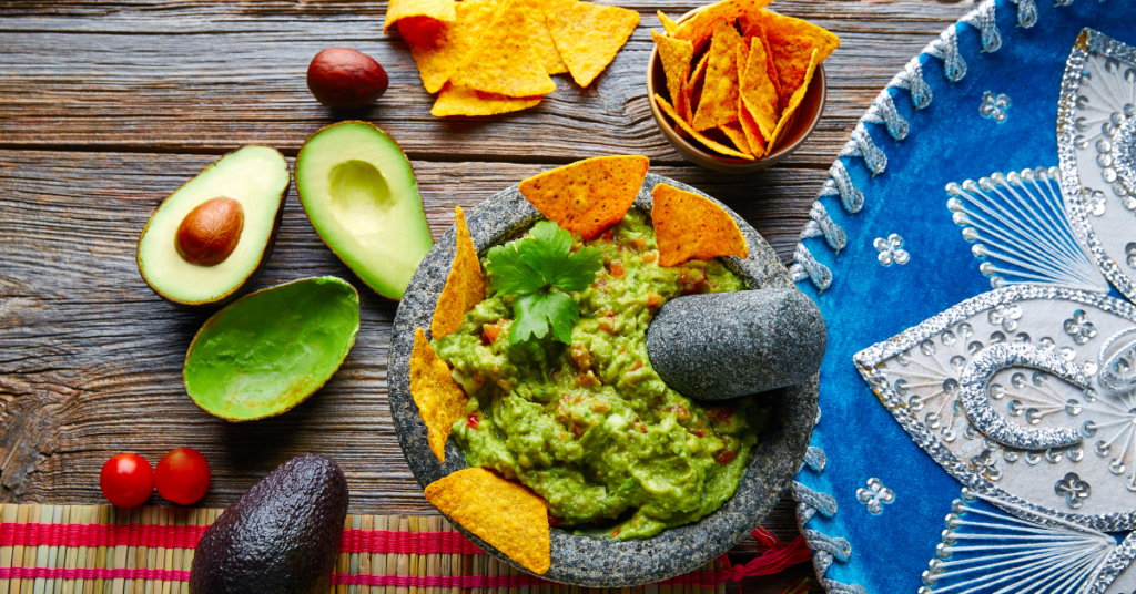 Mexican guacamole with tortilla chips and fresh avocado