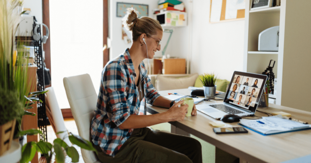 Woman at home listening in on Zoom call