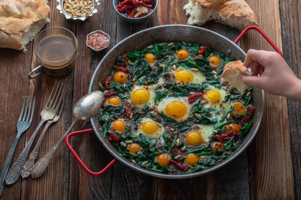 team member making shakshuka