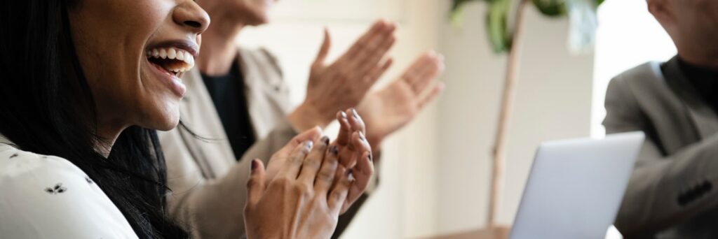 happy team members clapping