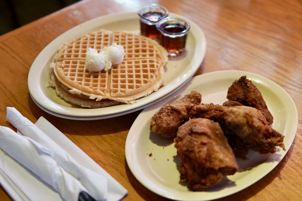 Classic soul food chicken and waffles with maple syrup